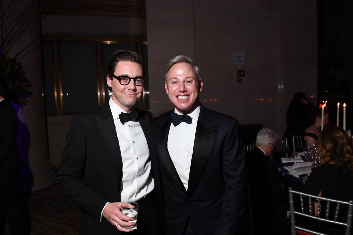 amfAR Board Member Michael Lorber and guest (Ryan Emberley)