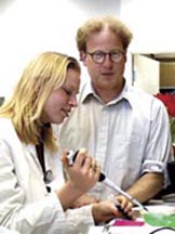 Dr. Nathaniel Landau, an amfAR grantee, with a research associate in his laboratory