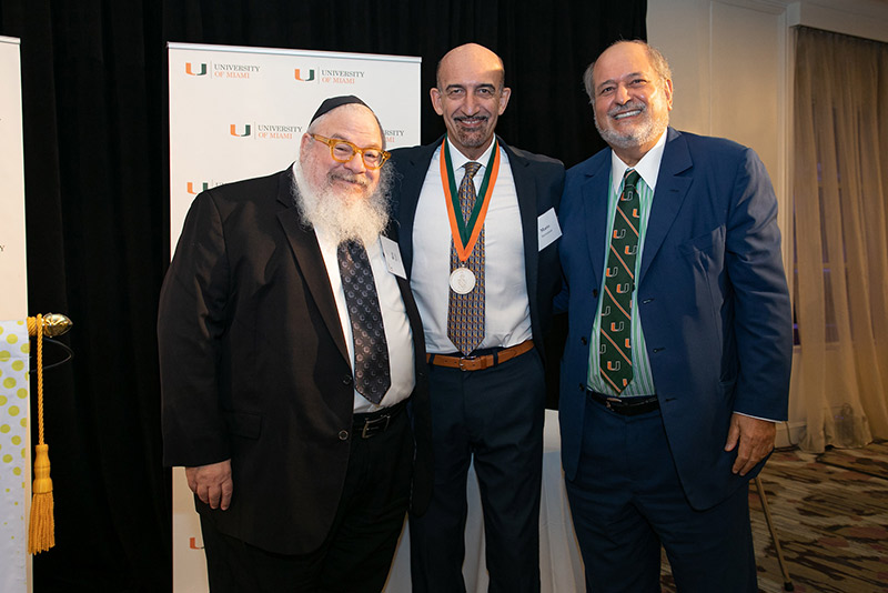 Roy E. Weiss, M.D., Ph.D., chair of the Department of Medicine at the Miller School, Mario Stevenson, Ph.D., and Raymond F. Schinazi, Ph.D. (Photo: Jenny Abreu)