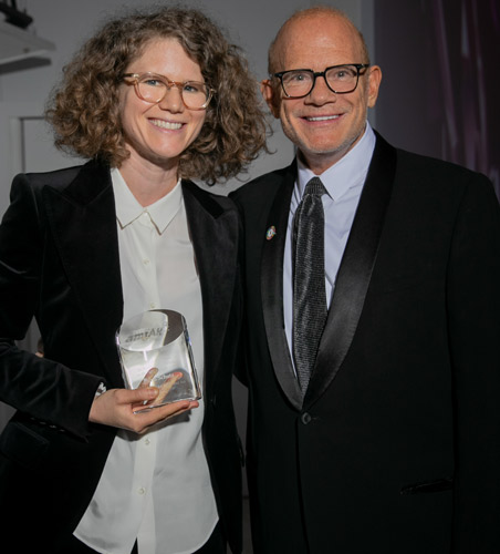 Dana Schutz (Left) with amfAR Trustee Bill Roedy (Right) (Photo by Kevin Tachman)