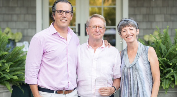 David Bohnett is flanked by amfAR Board Co-Chair T. Ryan Greenawalt and VP and Director of Research Dr. Rowena Johnston