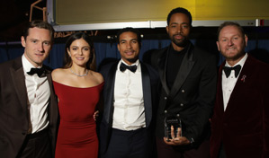 The cast of Top Gun: Maverick, Lewis Pullman, Monica Barbaro, Greg Tarzan Davis, and amfAR Trustee Jay Ellis accepted the amfAR Philanthropic Leadership Award on behalf of Paramount Pictures, with amfAR CEO Kevin Robert Frost