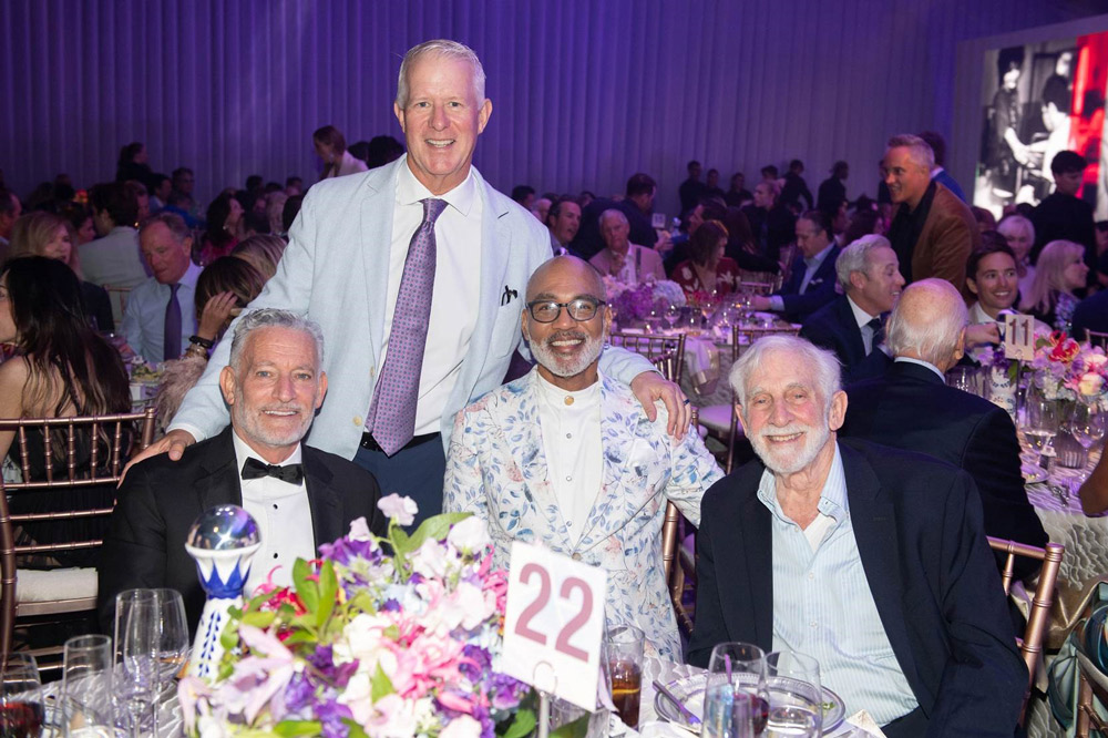 amfAR Board Co-Chair Kevin McClatchy (standing) with Trustees (L-R) Jeffrey Schoenfeld, Phill Wilson, and Dr. Mervyn Silverman (Photo: Ryan Emberley)