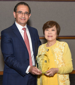 Dr. Hashem El-Serag (left) giving Dr. Nancy Change (right) an award honoring her impact on the Department of Medicine at Baylor College of Medicine (Photo courtesy Baylor College of Medicine)