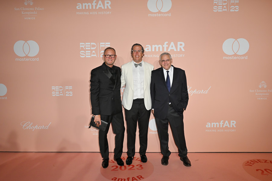 Left to right: Kevin Robert Frost, amfAR's chief executive officer, T. Ryan Greenawalt, amfAR Co-Chair, and guest. Photo by Getty Images