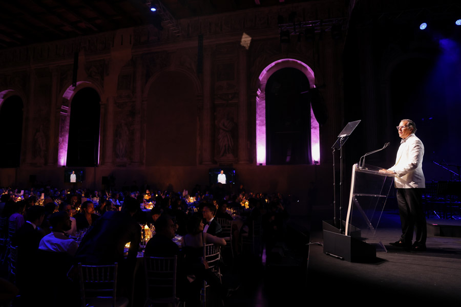 amfAR Co-Chair T. Ryan Greenawalt addresses gala attendees about improving the lives of people impacted by HIV/AIDS. Photo by Getty Images