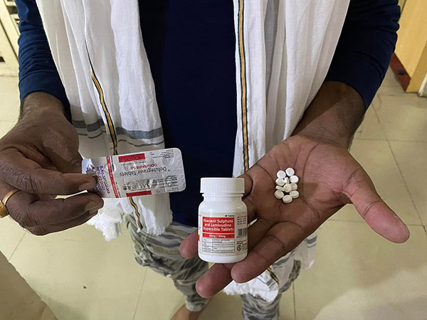 Pill bottles illustrating the increased medication burden during India's ARV stockout