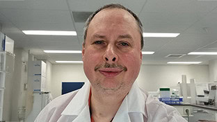 Portrait of Dr. Alexander O. Pasternak, researching how killer T cells combat hidden HIV reservoirs