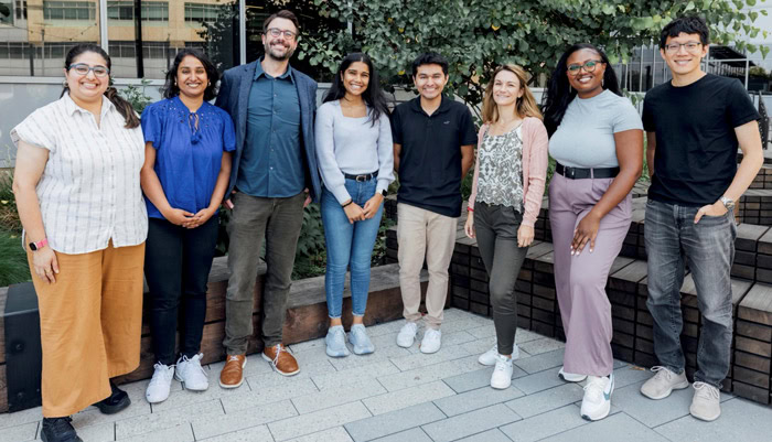 Group photo of the research team studying HIV protein localization within cells, from amfAR news