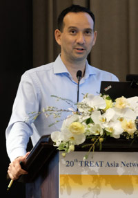Dr. Jeremy Ross, TREAT Asia's director of research, speaking at a podium