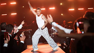 Robbie Williams performing at amfAR's Gala Cannes fundraiser