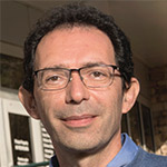 Headshot of Dr. Mirko Paiardini of Emory University, studying an anti-cancer drug's potential for HIV cure