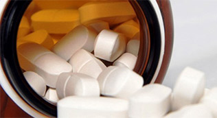 Antiretroviral pills representing amfAR-supported HIV treatment breakthroughs