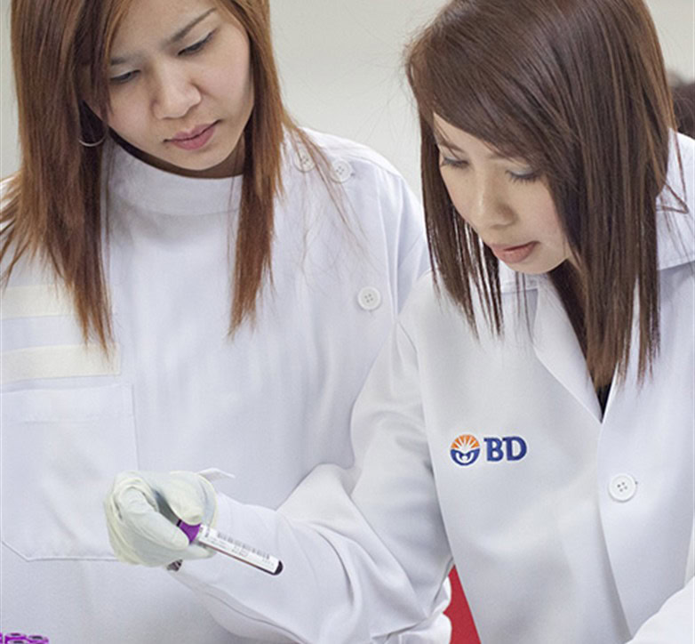 Lab technicians reviewing a sample, photo from TREAT Asia 2012, credit Kevin Tachman