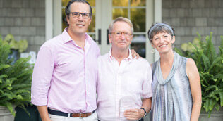 David Bohnett is flanked by amfAR Board Co-Chair T. Ryan Greenawalt and VP and Director of Research Dr. Rowena Johnston